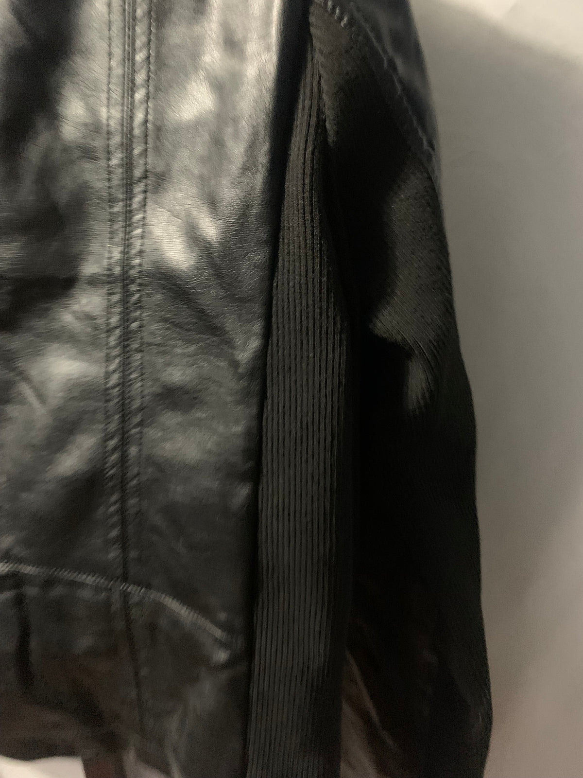 Black faux leather jacket with zipper details, size S #bikerchic #edgy