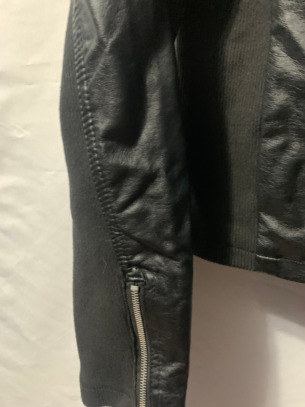 Black faux leather jacket with zipper details, size S #bikerchic #edgy