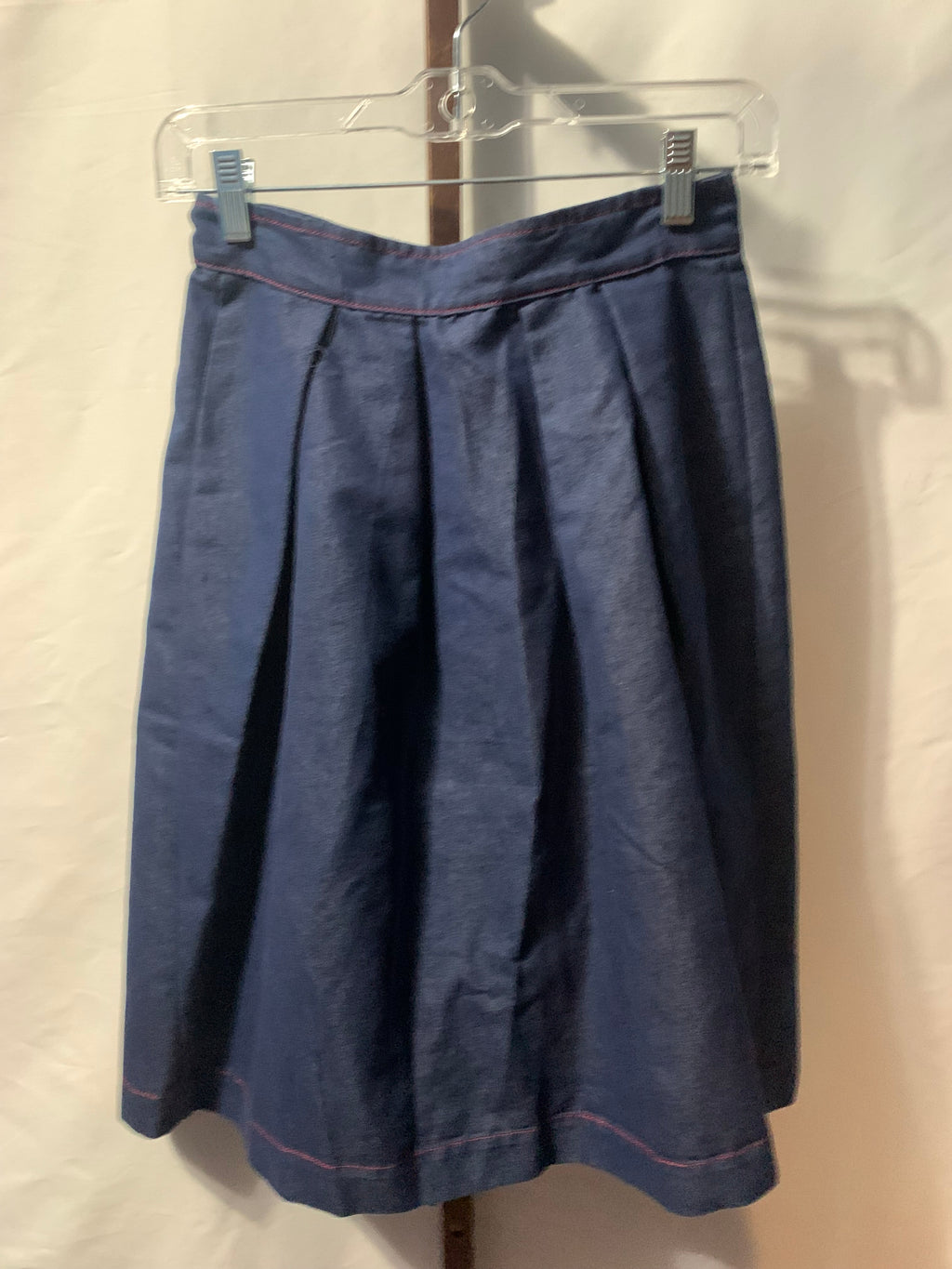 TShirterie navy blue cotton, polyester & tencel midi skirt with red stitching and button detail #midi #buttondetail